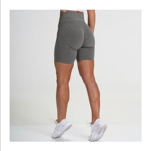 NVGTN khaki green bike shorts size M.